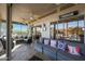 Relaxing screened patio with comfortable seating and ceiling fans at 15938 W Summerwalk Dr, Surprise, AZ 85374