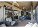 Covered patio boasts ceiling fans and comfy seating at 15938 W Summerwalk Dr, Surprise, AZ 85374