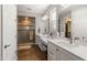 Spa-like bathroom with double vanity and walk-in shower at 16925 W Virginia Ave, Goodyear, AZ 85395
