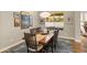 Elegant dining room featuring a rustic wood table and six chairs at 16925 W Virginia Ave, Goodyear, AZ 85395