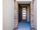 Modern front door entry with stone accents at 16925 W Virginia Ave, Goodyear, AZ 85395