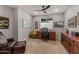Functional home office with built-in wood desk and comfortable seating at 16925 W Virginia Ave, Goodyear, AZ 85395