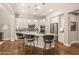 Modern kitchen with white cabinets, stainless steel appliances, and an island at 16925 W Virginia Ave, Goodyear, AZ 85395