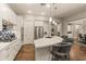 Modern kitchen island with seating and stainless steel appliances at 16925 W Virginia Ave, Goodyear, AZ 85395