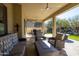 Relaxing covered patio with seating area and fire pit at 16925 W Virginia Ave, Goodyear, AZ 85395