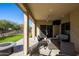 Spacious covered patio furniture with a fire pit at 16925 W Virginia Ave, Goodyear, AZ 85395
