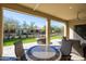 Covered patio with seating area, fire pit, and artificial turf at 16925 W Virginia Ave, Goodyear, AZ 85395