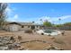 Backyard with kidney-shaped pool, shed, and rock landscaping at 17112 E La Pasada Dr, Fountain Hills, AZ 85268