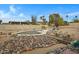 Backyard pool and patio area with rock landscaping at 17112 E La Pasada Dr, Fountain Hills, AZ 85268