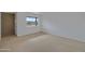 Simple bedroom with carpet and large window at 17112 E La Pasada Dr, Fountain Hills, AZ 85268