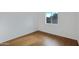 Simple bedroom featuring wood-look flooring and a window at 17112 E La Pasada Dr, Fountain Hills, AZ 85268