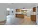Kitchen with breakfast bar and view into living area at 17112 E La Pasada Dr, Fountain Hills, AZ 85268