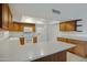 Kitchen with light counters and wood cabinets at 17112 E La Pasada Dr, Fountain Hills, AZ 85268