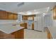 View of kitchen with white appliances and wood cabinets at 17112 E La Pasada Dr, Fountain Hills, AZ 85268