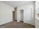 Spacious bedroom with carpet, closet, and access to a bathroom at 1779 W Spaulding Ave, Apache Junction, AZ 85120