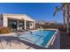 Landscaped backyard with pool, patio, and lounge chairs at 22543 E Calle De Flores --, Queen Creek, AZ 85142