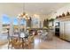 Gourmet kitchen with island, granite countertops, and high-end appliances at 26485 N 108Th Way, Scottsdale, AZ 85255