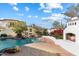 Stunning pool and outdoor fireplace with flagstone patio at 26485 N 108Th Way, Scottsdale, AZ 85255