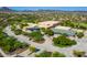 Aerial view of community amenities, including a school and expansive parking lot at 30213 N 124Th Ln, Peoria, AZ 85383