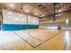 Indoor basketball court with bleachers, perfect for recreational sports at 30213 N 124Th Ln, Peoria, AZ 85383