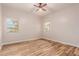 Bedroom with wood-look floors and ceiling fan at 30213 N 124Th Ln, Peoria, AZ 85383