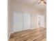 Bedroom with wood-look floors and double closet doors at 30213 N 124Th Ln, Peoria, AZ 85383