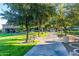 Landscaped walkway with benches, providing a peaceful stroll through the community at 30213 N 124Th Ln, Peoria, AZ 85383