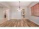 Elegant dining room with hardwood floors and chandelier at 30213 N 124Th Ln, Peoria, AZ 85383