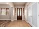 Bright and spacious entryway with tile floors and wood doors at 30213 N 124Th Ln, Peoria, AZ 85383