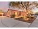 Beautiful desert landscape surrounds this single-story home with a large covered entry at 30213 N 124Th Ln, Peoria, AZ 85383