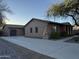 Single-story home with stucco exterior, two-car garage, and landscaped front yard at 30213 N 124Th Ln, Peoria, AZ 85383