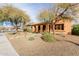 Single story home with attractive landscaping and stone pathway at 30213 N 124Th Ln, Peoria, AZ 85383