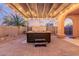 Hot tub under a pergola with surrounding landscaping at 30213 N 124Th Ln, Peoria, AZ 85383