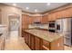 Kitchen with granite countertops, stainless steel appliances, and an island at 30213 N 124Th Ln, Peoria, AZ 85383