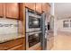 Stainless steel appliances in a modern kitchen setting at 30213 N 124Th Ln, Peoria, AZ 85383