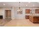 Kitchen features an island and wood cabinets at 30213 N 124Th Ln, Peoria, AZ 85383