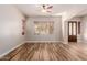Light and airy living room with hardwood floors and ceiling fan at 30213 N 124Th Ln, Peoria, AZ 85383