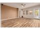 Bright living room with hardwood floors and access to backyard at 30213 N 124Th Ln, Peoria, AZ 85383