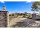 Brick driveway leading to a large luxury home with stone pillars at 30409 N 142Nd St, Scottsdale, AZ 85262