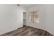 Bright bedroom with a large window and wood-look flooring at 3041 E Wahalla Ln, Phoenix, AZ 85050