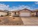 Single-story house with a two-car garage and desert landscaping at 3041 E Wahalla Ln, Phoenix, AZ 85050