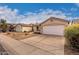 Houses with desert landscaping and a paved walkway at 3041 E Wahalla Ln, Phoenix, AZ 85050