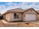 House with a two-car garage, cacti, and walkway at 3041 E Wahalla Ln, Phoenix, AZ 85050
