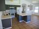 Spacious kitchen featuring an island and an open layout adjacent to the living space at 3041 E Wahalla Ln, Phoenix, AZ 85050
