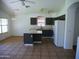Spacious kitchen with island and stainless steel appliances, featuring ample lighting and open layout at 3041 E Wahalla Ln, Phoenix, AZ 85050