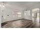Living room with dark wood-look floors and views into kitchen at 3041 E Wahalla Ln, Phoenix, AZ 85050
