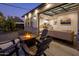Backyard with fire pit, pergola, and outdoor kitchen at 3322 N Valencia Ln, Phoenix, AZ 85018