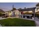 Backyard with a casita, outdoor kitchen, and pergola at 3322 N Valencia Ln, Phoenix, AZ 85018
