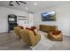 Fun game room with a TV, arcade machine, and cozy seating, perfect for entertainment at 3322 N Valencia Ln, Phoenix, AZ 85018