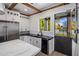 Modern kitchen with black and white finishes and a pool view at 3322 N Valencia Ln, Phoenix, AZ 85018